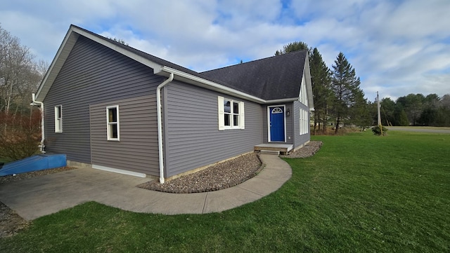 8065 Rte 414, Liberty, PA 16930 - view of side of home with a yard, roof with shingles, and a patio area