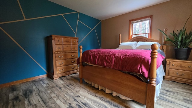 8065 Rte 414, Liberty, PA 16930 - bedroom with wood finished floors, baseboards, and vaulted ceiling