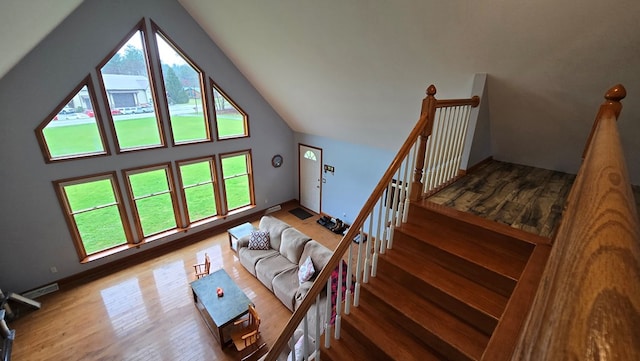 8065 Rte 414, Liberty, PA 16930 - living room with visible vents, wood finished floors, and vaulted ceiling