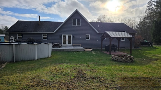 8065 Rte 414, Liberty, PA 16930 - rear view of property with a fire pit, french doors, a wooden deck, a gazebo, and a lawn