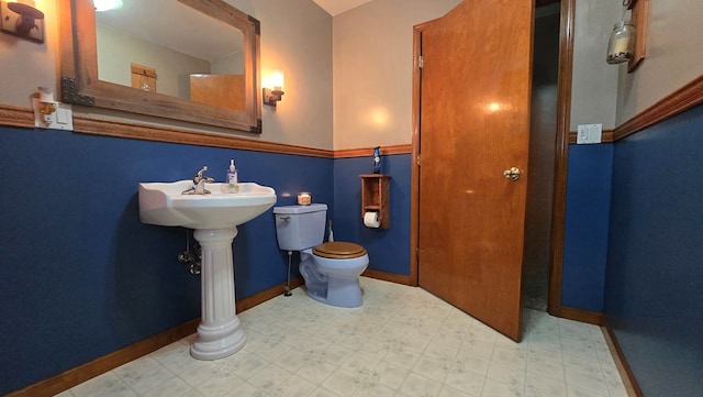 8065 Rte 414, Liberty, PA 16930 - bathroom featuring tile patterned floors, baseboards, and toilet
