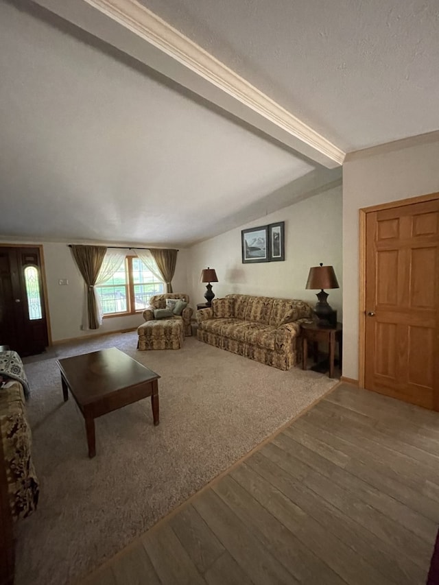 living room featuring lofted ceiling with beams, a textured ceiling, and hardwood / wood-style flooring