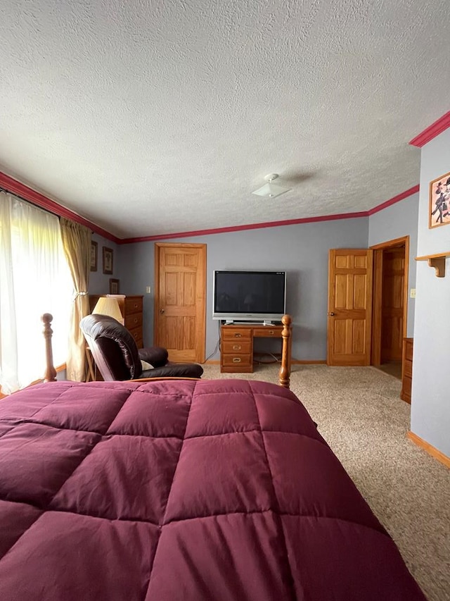 carpeted bedroom with a textured ceiling and ornamental molding