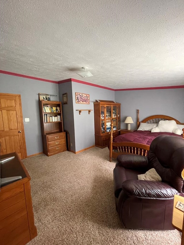 bedroom featuring a textured ceiling, carpet floors, and ornamental molding