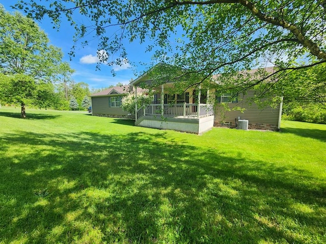 view of yard with a wooden deck