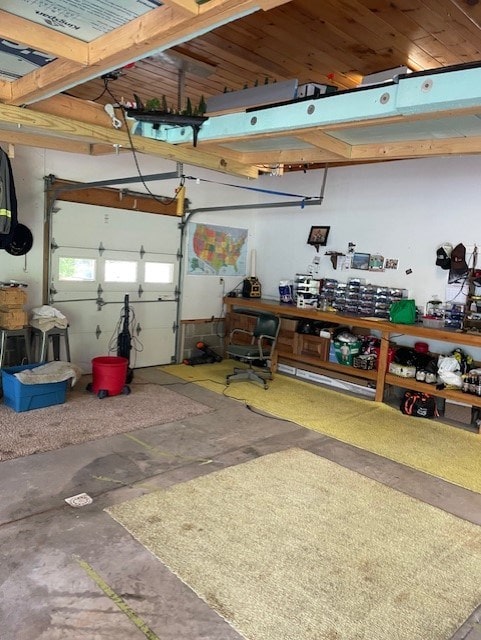 garage featuring a workshop area and a garage door opener