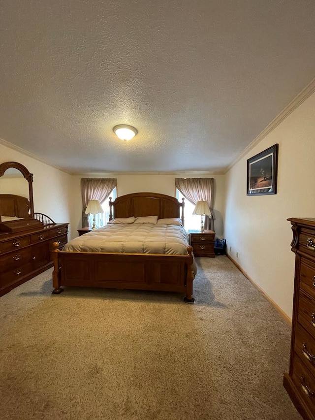 carpeted bedroom with ornamental molding and a textured ceiling