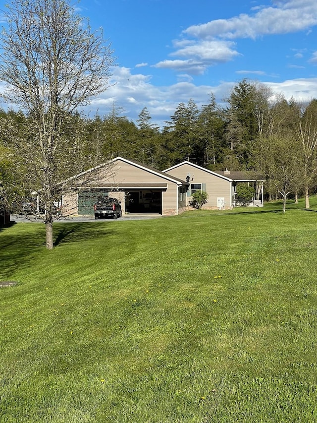 view of yard featuring a garage