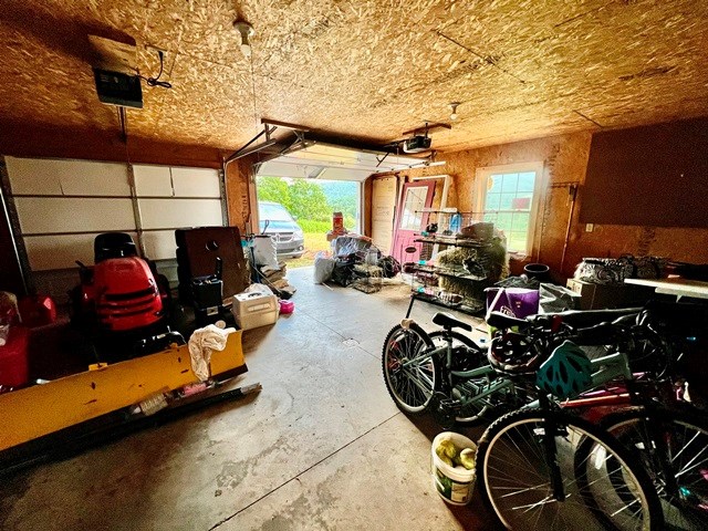 19 Angel Trl, Duke Center, PA 16729 - garage featuring a garage door opener