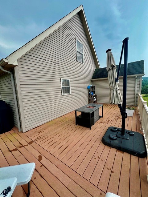 19 Angel Trl, Duke Center, PA 16729 - wooden terrace with a fire pit
