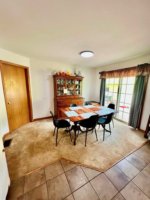 19 Angel Trl, Duke Center, PA 16729 - dining space featuring light tile patterned floors and light carpet