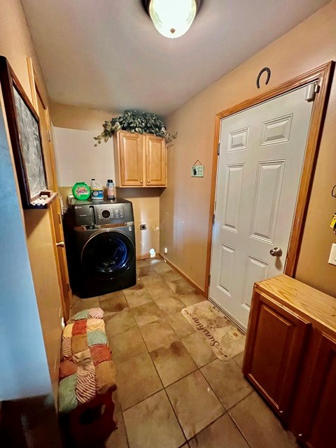 19 Angel Trl, Duke Center, PA 16729 - washroom with washer / dryer, cabinet space, and light tile patterned floors