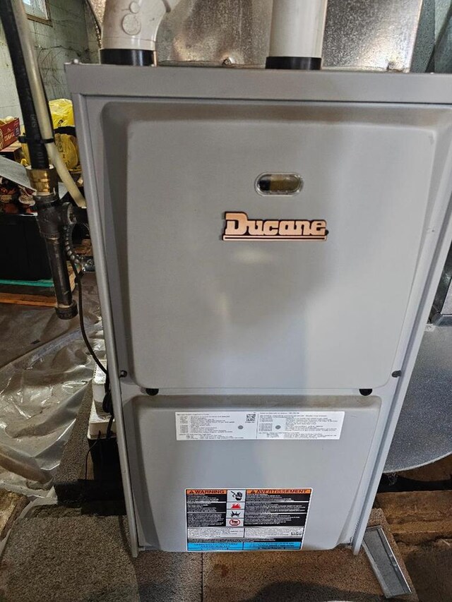 409 E Main St, Elkland, PA 16920 - utility room featuring heating unit