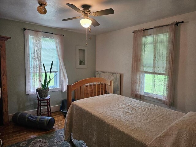409 E Main St, Elkland, PA 16920 - bedroom featuring wood finished floors, baseboards, and ceiling fan