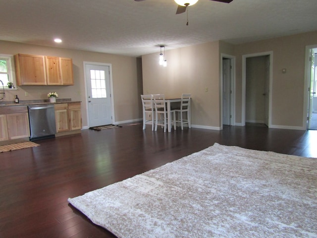 interior space featuring ceiling fan and dark wood-type flooring