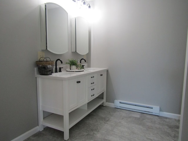 bathroom with vanity and a baseboard heating unit