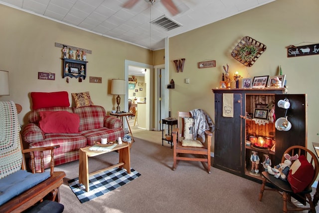 carpeted living room featuring ceiling fan