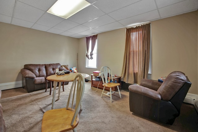 living room featuring a paneled ceiling and light colored carpet