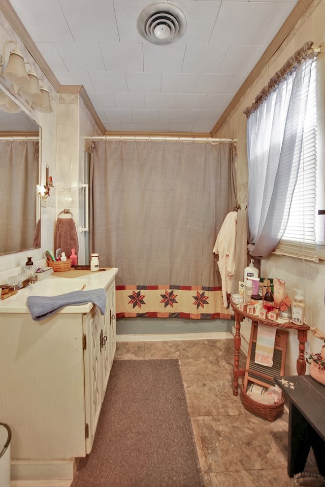 bathroom featuring vanity, walk in shower, and a wealth of natural light