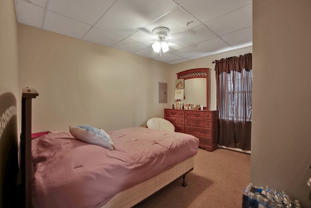 carpeted bedroom with a drop ceiling