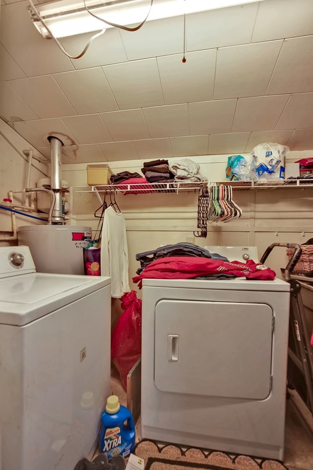 laundry room featuring independent washer and dryer and water heater