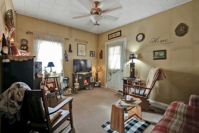 living room with light colored carpet and ceiling fan