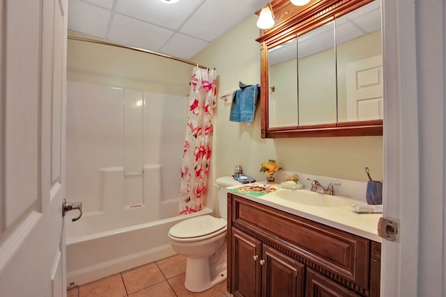 full bathroom with shower / tub combo, tile patterned flooring, toilet, a paneled ceiling, and vanity