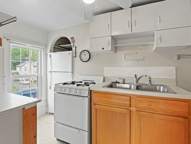 4 Pine St, Waverly, NY 14892 - kitchen with white appliances, a sink, light countertops, and light tile patterned floors