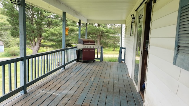 deck featuring a grill and covered porch