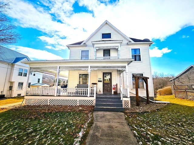 view of front facade with a porch and a front yard