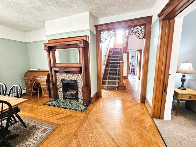 living room featuring a textured ceiling and hardwood / wood-style flooring