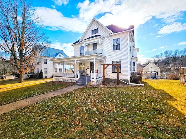 view of front of property featuring a porch and a front lawn