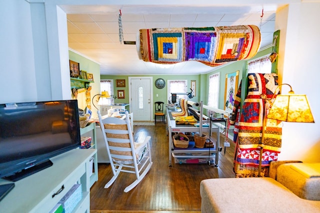 interior space featuring crown molding and dark hardwood / wood-style flooring