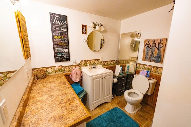 bathroom featuring vanity, toilet, and tile patterned flooring