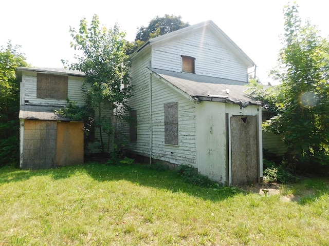 back of house with a yard