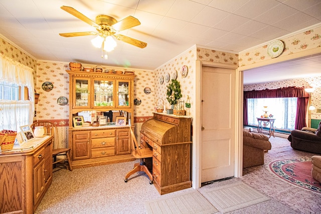 office with ceiling fan, light colored carpet, and ornamental molding