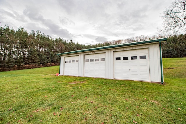 garage featuring a yard