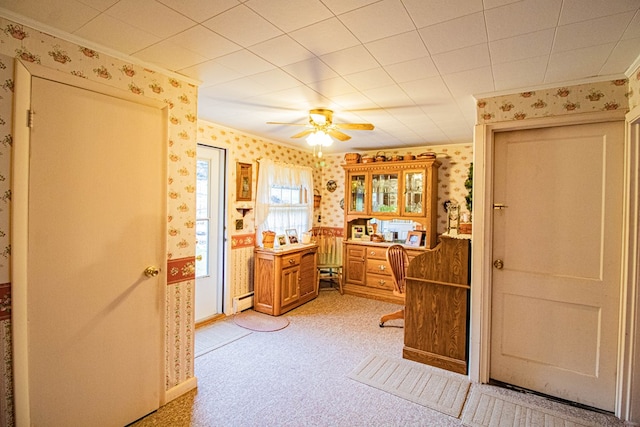 bathroom with ceiling fan and a baseboard radiator