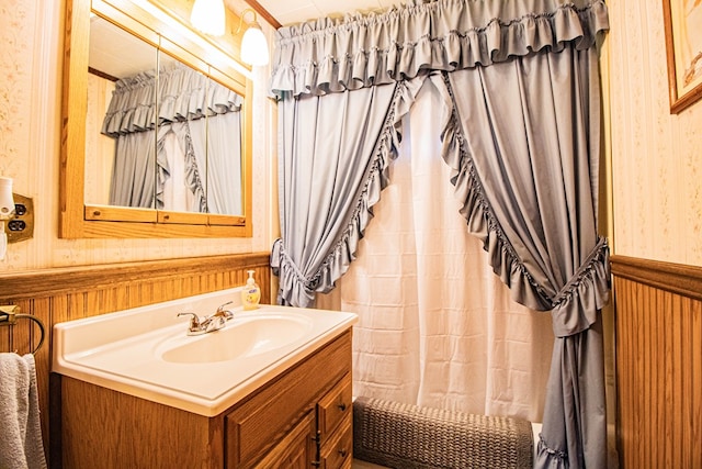 bathroom with shower / bathtub combination with curtain and vanity