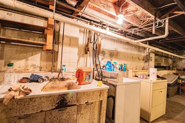 laundry room featuring washer and dryer and sink