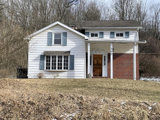 view of property featuring a front yard