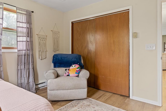 118 Milton Ln, Warren Center, PA 18851 - bedroom featuring a closet, wood finished floors, baseboard heating, and baseboards
