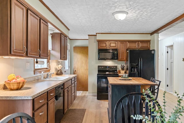 118 Milton Ln, Warren Center, PA 18851 - kitchen with black appliances, a sink, wooden counters, ornamental molding, and brown cabinets