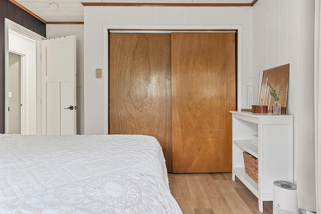 118 Milton Ln, Warren Center, PA 18851 - bedroom featuring crown molding, light wood-style floors, and a closet