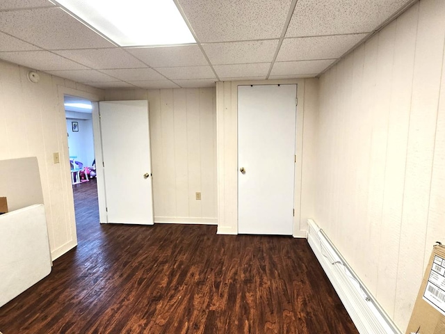 118 Milton Ln, Warren Center, PA 18851 - finished basement featuring a paneled ceiling, wood finished floors, baseboard heating, and baseboards