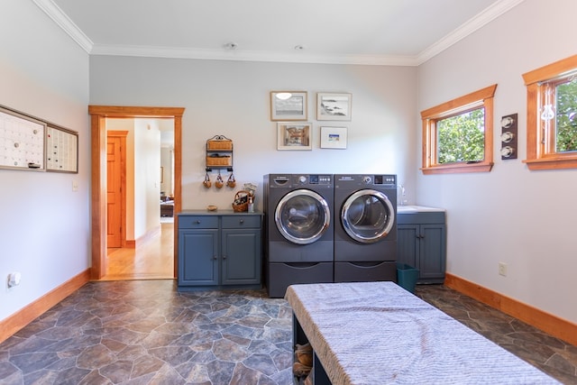 washroom with cabinets, separate washer and dryer, and ornamental molding