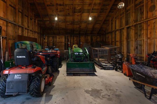 garage featuring wood walls