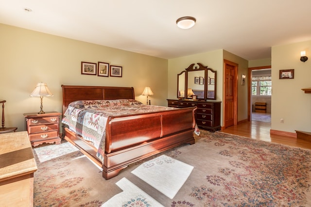 bedroom with hardwood / wood-style flooring