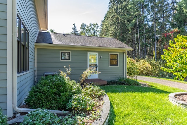 view of side of home featuring a lawn