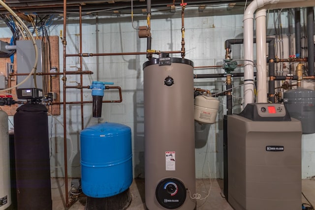 utility room featuring water heater